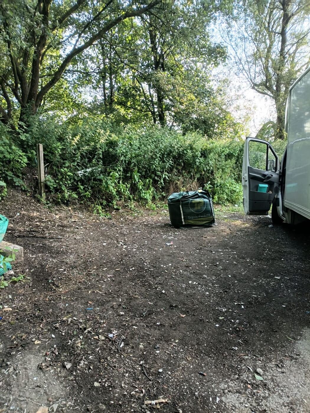 Our collection van loading waste on site